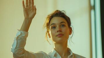A Young Woman Waves Elegantly Beneath Soft Golden Light in a Cozy Indoor Setting photo