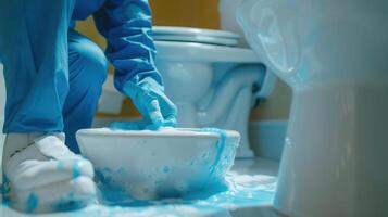 Diligent Person Using Bright Blue Cleaning Solution in Bathroom at Morning Hour photo