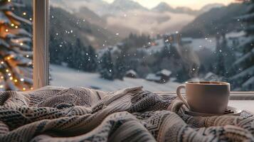 Cozy Winter Morning View of Snow-Covered Mountains and Warm Beverage on a Windowsill photo