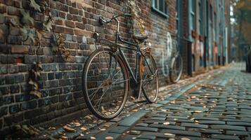 Charming Bicycle Leaning Against an Old Brick Wall on a Leafy Cobblestone Street in Autumn Afternoon Light photo