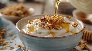 Delicious Homemade Yogurt Topped With Crunchy Granola and Drizzled Honey in Cozy Kitchen Setting photo