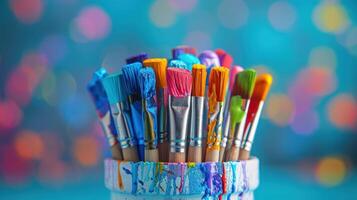Vibrant Collection of Paint Brushes in a Colorful Studio Setting on a Sunny Afternoon photo