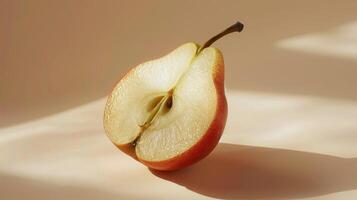 Slice of Juicy Pear Resting on Soft Surface Bathed in Gentle Natural Light During Afternoon Hours photo