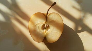 A Close-Up View of a Halved Apple Revealing Intricate Seed Patterns and Beautiful Natural Light photo