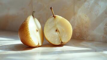 Delicately Sliced Pears Glimmering in Sunlight on a Marble Countertop During a Serene Morning photo