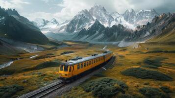 A Vibrant Yellow Train Travels Through Majestic Mountain Landscape Under Dramatic Skies During Late Afternoon photo