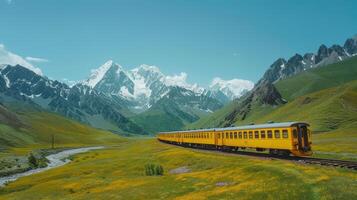Majestic Train Journey Through Lush Meadows and Snow-Capped Mountains Under a Bright Blue Sky photo