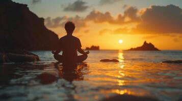 Serene Meditation by the Tranquil Shore at Sunset During a Peaceful Evening Retreat photo