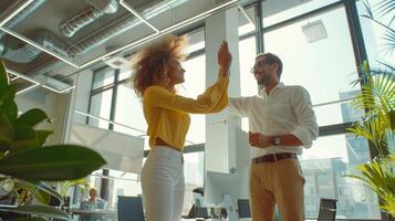 Joyful Colleagues Celebrating a Successful Project Completion in a Bright Modern Office photo