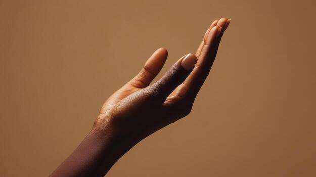 Open Hand Displaying Gesture Against Neutral Background in Soft Lighting During Indoor Setting photo