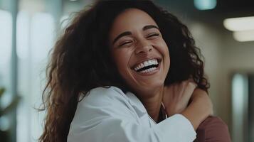 Two friends share a heartwarming hug filled with laughter and joy photo