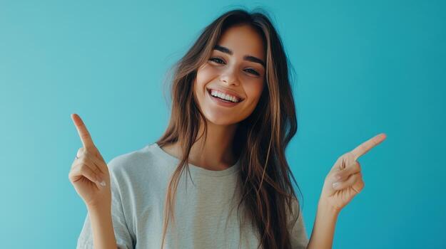 A cheerful woman joyfully points in different directions with enthusiasm photo