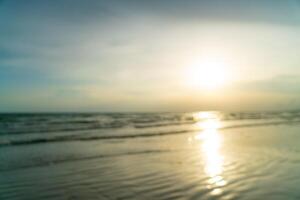 abstract blur beautiful sea beach with sunset time for background photo