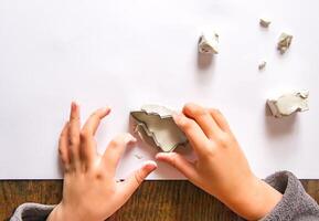 Figures creation from modeling clay. Creative activities in the process. Christmas and New Year handmade decor. photo