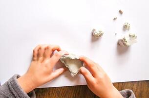 Figures creation from modeling clay. Creative activities in the process. Christmas and New Year handmade decor. photo