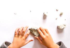 Figures creation from modeling clay. Creative activities in the process. Christmas and New Year handmade decor. photo