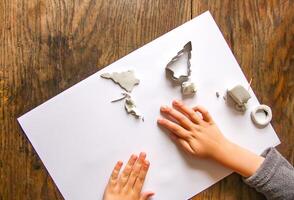 Figures creation from modeling clay. Creative activities in the process. Christmas and New Year handmade decor. photo