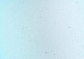 Blurred winter photo overlay. Empty space. Light background with fluffy flying snowflakes.