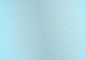 Blurred winter photo overlay. Empty space. Light background with fluffy flying snowflakes.