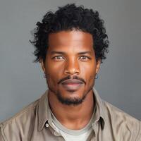 Confident African American Man With Curly Hair on Solid Background photo