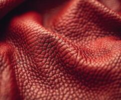 Close-Up of Textured Red Leather Material With Intricate Patterns photo