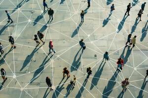 Aerial view of people walking on a large square with connections between them photo