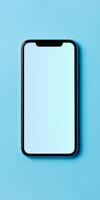 Smartphone with white screen is lying on a blue background, showcasing its sleek design and large display photo