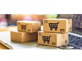 Cardboard boxes with shopping cart symbol representing online shopping concept photo