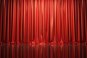 Red stage curtain closing on a black floor reflecting light photo