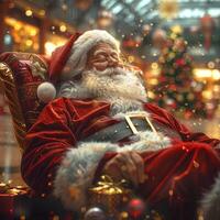 Santa claus relaxing in shopping mall after distributing presents photo