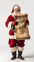 Santa claus reading long scroll of christmas wishes photo