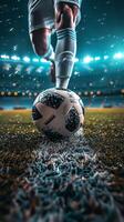 Soccer player about to kick ball in packed stadium at night photo