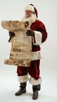 Santa claus reading a long parchment scroll on white background photo
