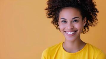 Smiling Woman in Yellow Shirt With Pink Headband Against Colorful Background photo