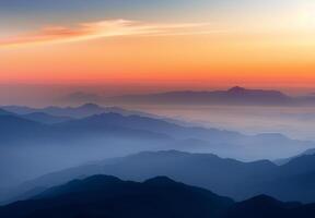 Serene Mountain Range at Dusk Overlooking Layered Blue Haze photo