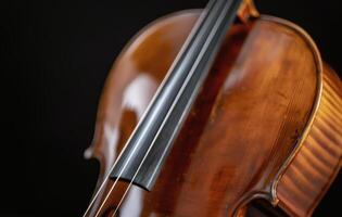 Close-Up of a Vibrant Violin Against a Dark Background photo