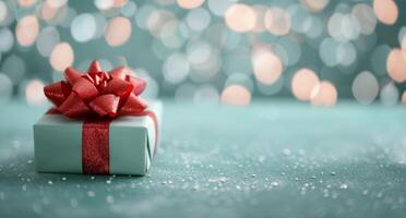 Festive Gift Wrapped in Red Ribbon Amidst Soft Snowfall and Glittering Lights photo