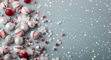 Festive Candy and Ornaments on a Light Blue Surface During the Holiday Season photo