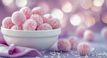 Colorful Candy Bowl With Purple and Pink Confections on a Soft Background photo