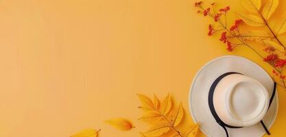 Cozy Autumn Accessories With Leaves on Yellow Background photo