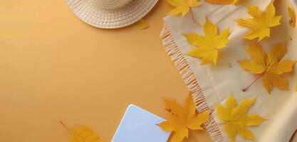 Cozy Autumn Accessories With Leaves on Yellow Background photo