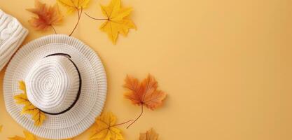 Cozy Autumn Accessories With Leaves on Yellow Background photo