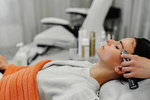 Relaxing facial treatment session in spa during afternoon with client enjoying skincare routine photo
