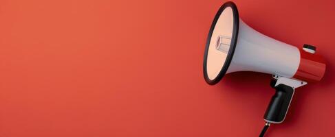 Megaphone Positioned on Red Background for Announcements and Communication photo