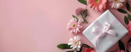 Gift Wrapped Package Surrounded by Colorful Flowers on a Pink Background photo