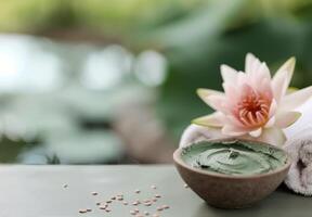 Natural Spa Treatment With Green Clay Mask and Lotus Flower Near Tranquil Water photo