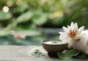 Natural Spa Treatment With Green Clay Mask and Lotus Flower Near Tranquil Water photo