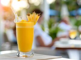Refreshing Pineapple Smoothie on a Sunny Day at a Relaxing Outdoor Cafe photo