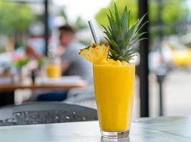 Refreshing Pineapple Smoothie on a Sunny Day at a Relaxing Outdoor Cafe photo
