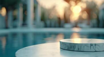 Marble Table Overlooking Tranquil Infinity Pool at Sunset photo
